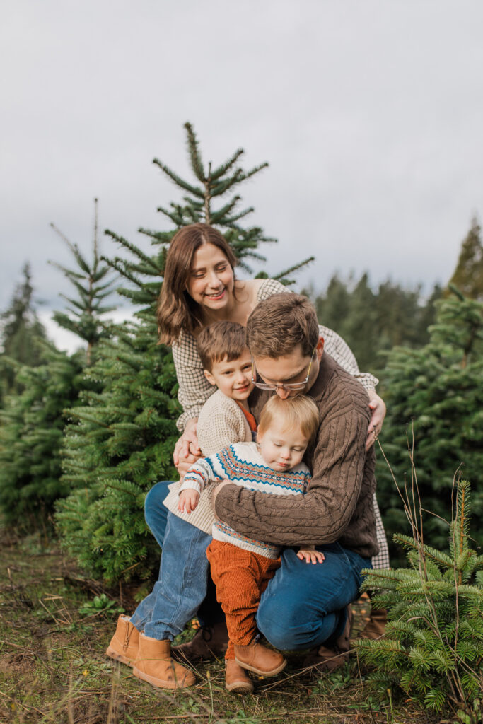 Snuggly and joyful holiday family photos taken by Lena Sophia Photography.
