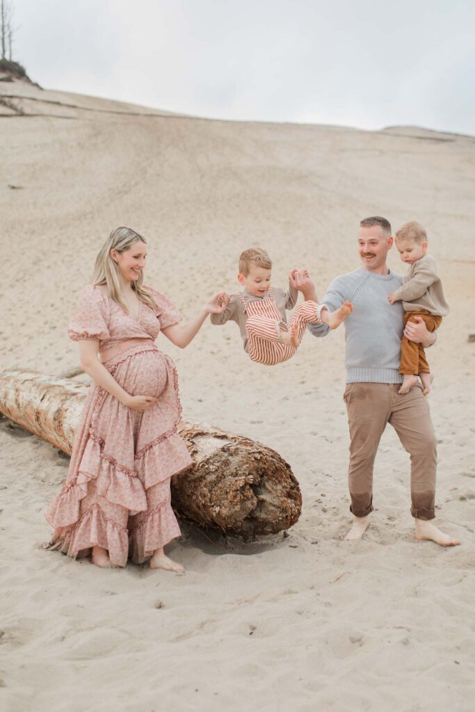 Mother and children laughing during Oregon Coast maternity photography