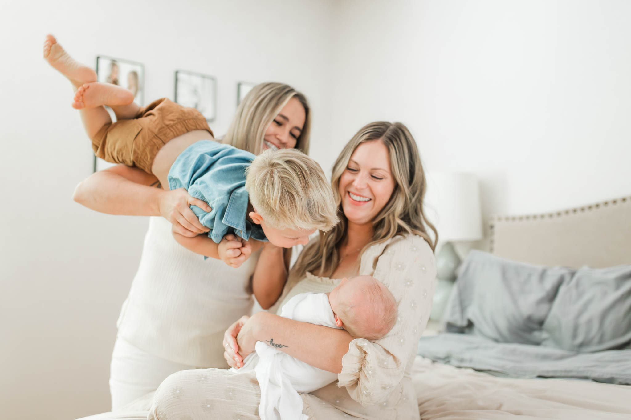 In-home newborn photography in Camas, WA with a toddler and newborn and their two moms
