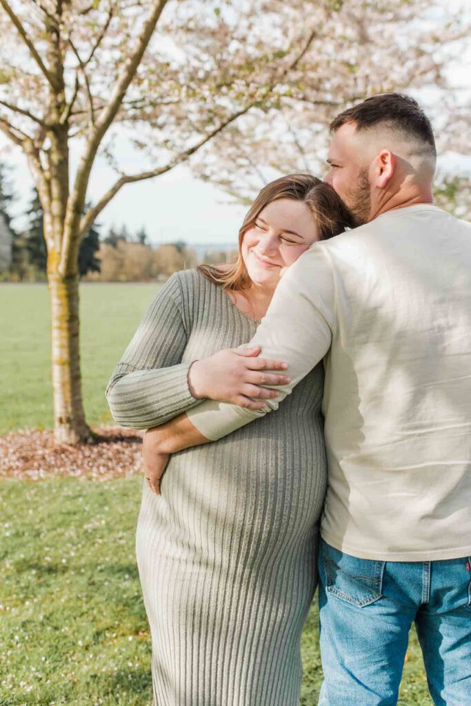 Spring maternity photos with cherry blossoms Vancouver Washington