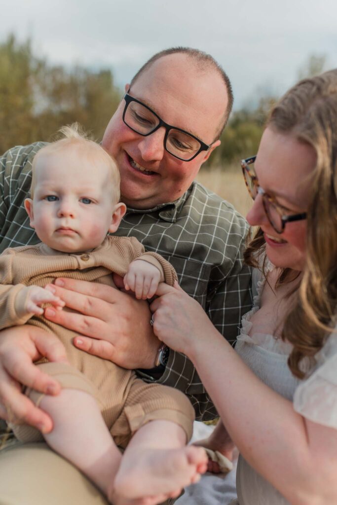 Parents and children layered in cozy fall outfits during their Fall family photo session in Vancouver WA