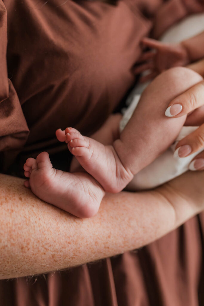 Details of a newborn baby without showing baby’s face, taken by a natural light newborn photographer in Portland OR