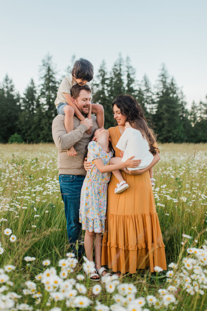 Camas WA family photographer capturing natural moments in a Shasta daisy field