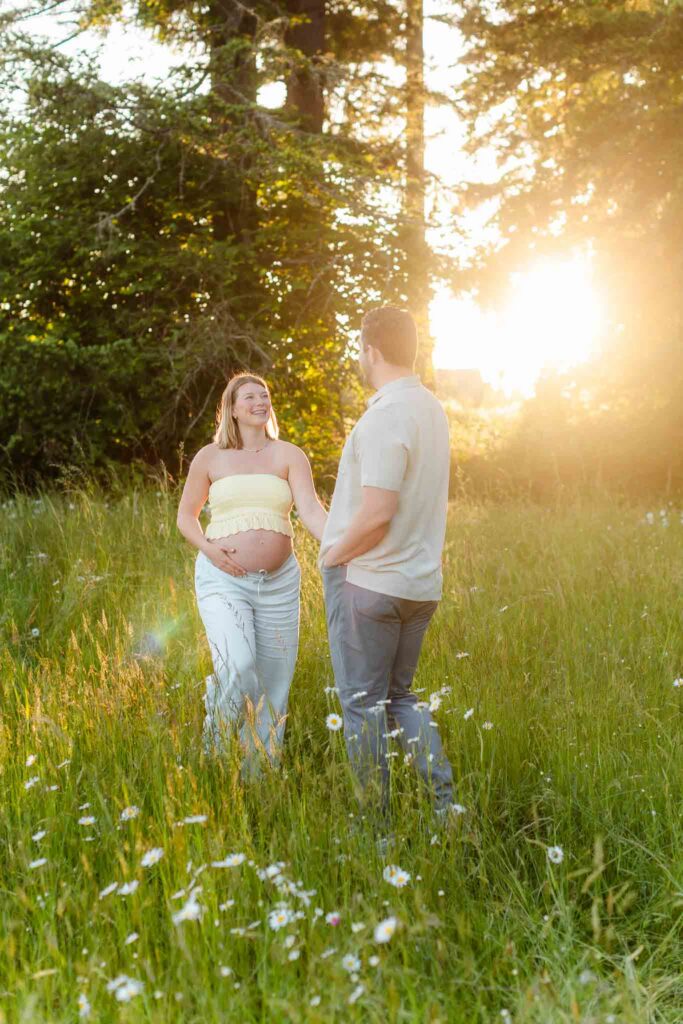 Golden hour maternity portraits in a wildflower field captured by a Camas WA maternity photographer.