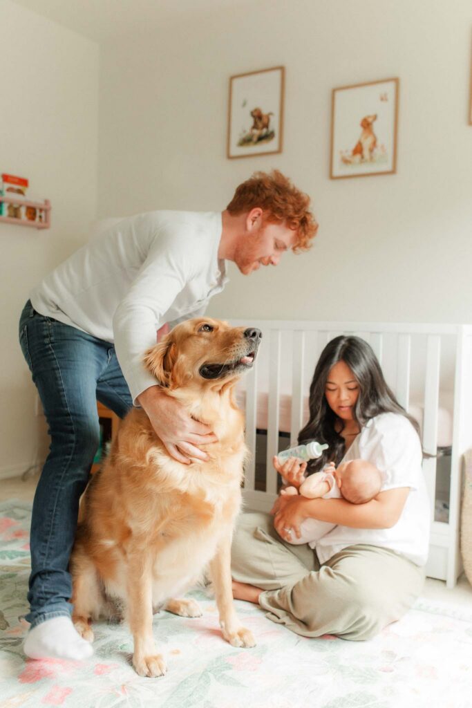 Lifestyle newborn family portrait by a Washougal WA in-home newborn photographer featuring parents and baby at home