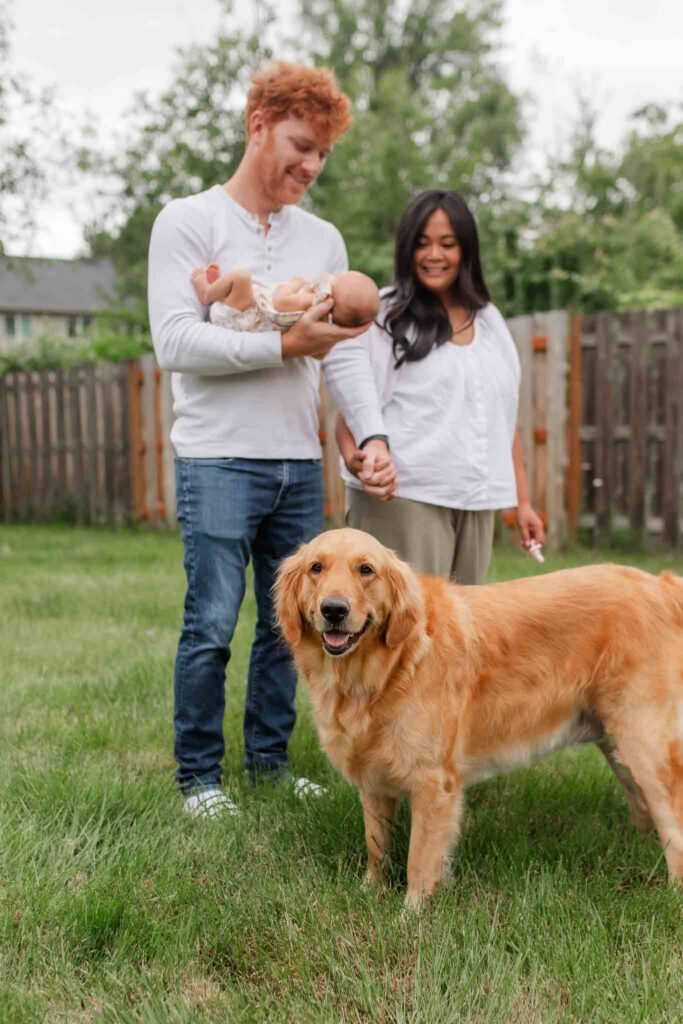 Backyard family portrait with newborn and dog during a lifestyle newborn session in Washougal Washington