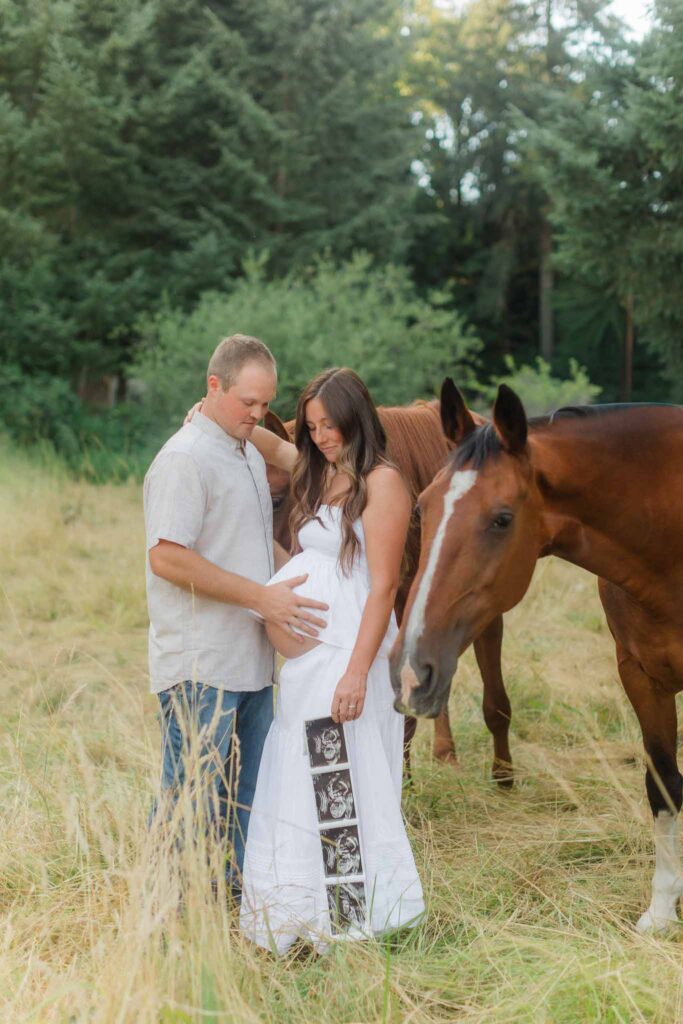 Ultrasound photos held during a western-inspired maternity session